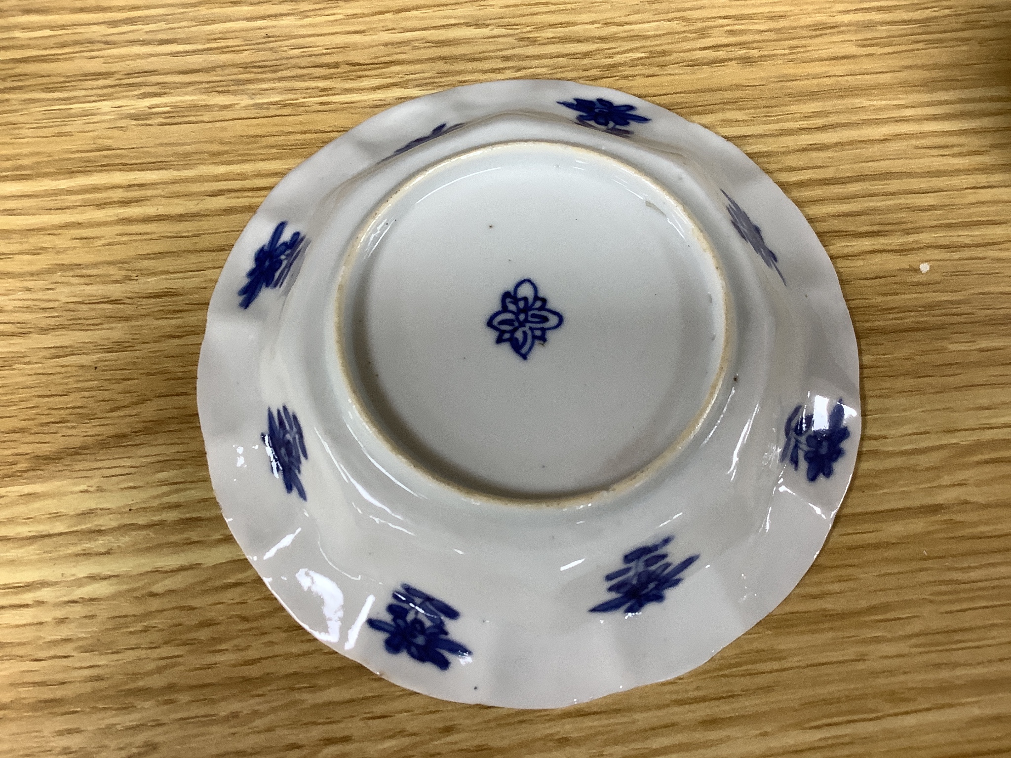 A Chinese blue and white plate 13cm diameter, a similar tea bowl and saucer, Kangxi period and a 19th century Chinese blue and white bottle vase